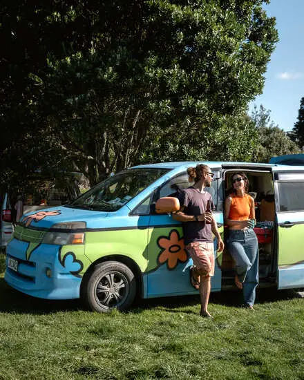 Happy travellers sharing Wicked road trip moments